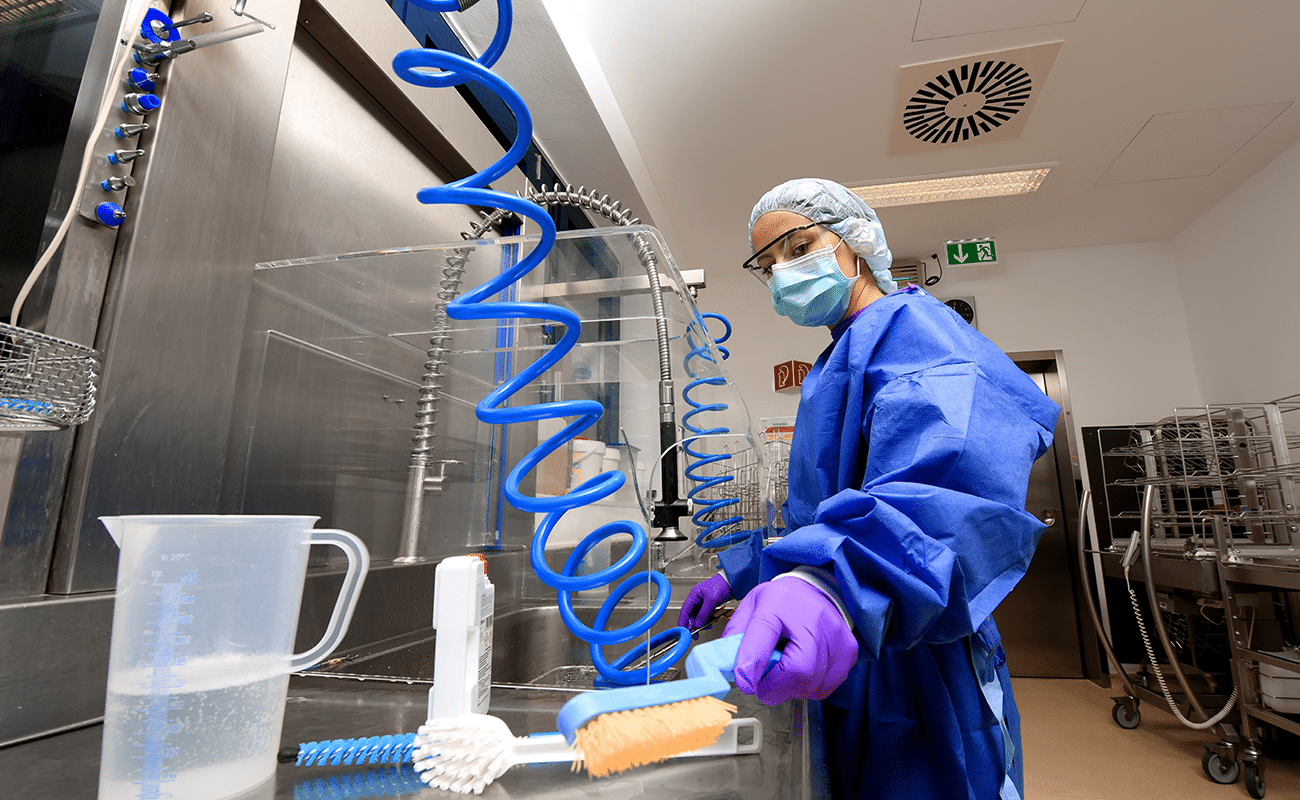 Hospital staff cleaning equipment