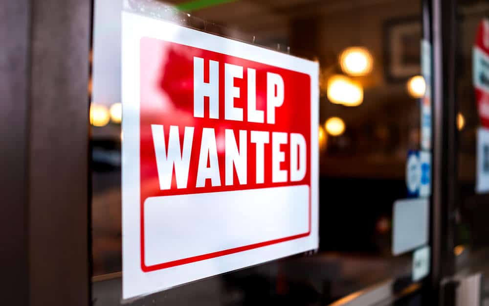 Help wanted sign on front of business window