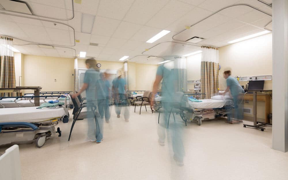 Nurses rushing around hospital floor